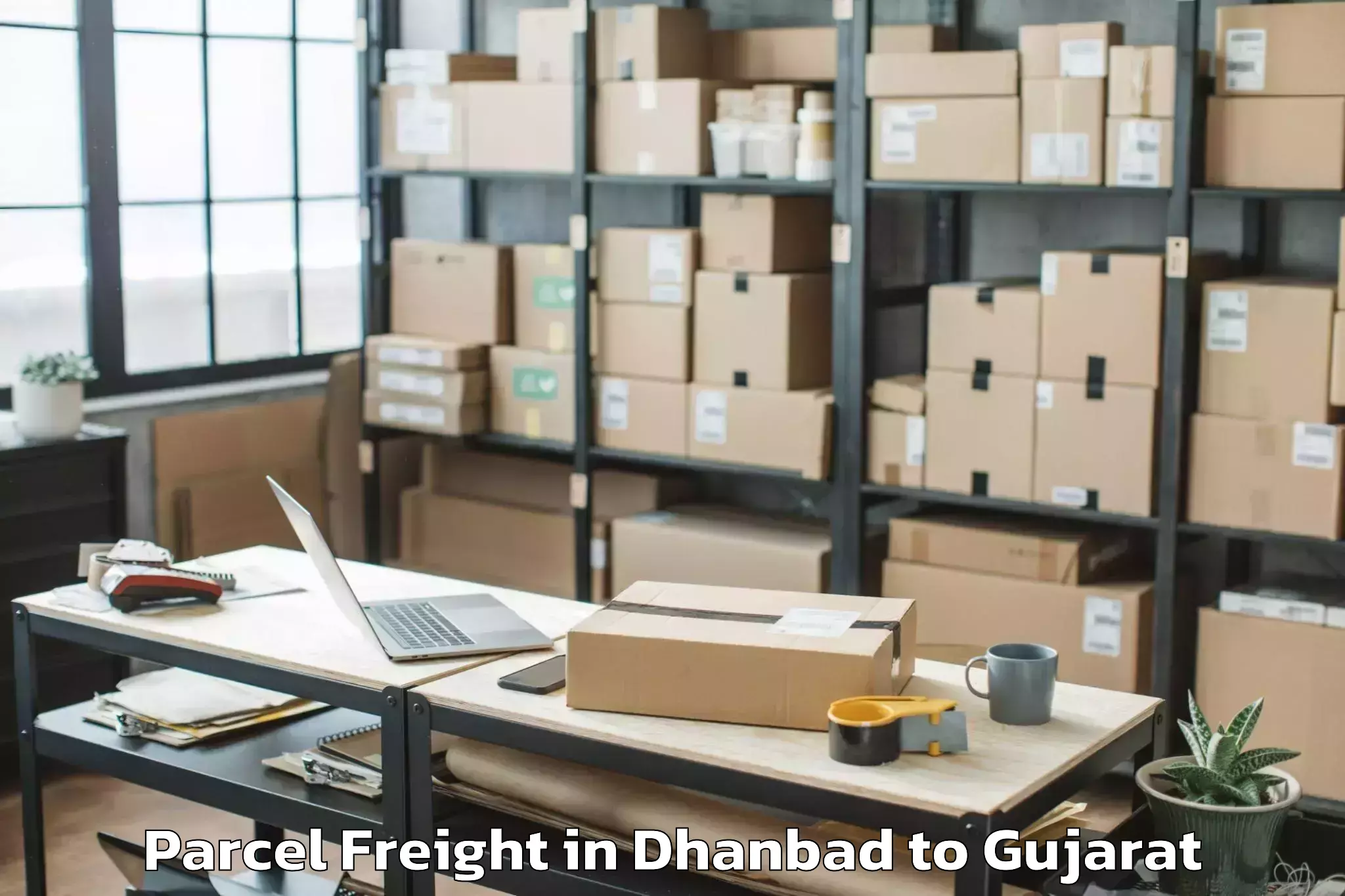 Book Dhanbad to Gussar Parcel Freight